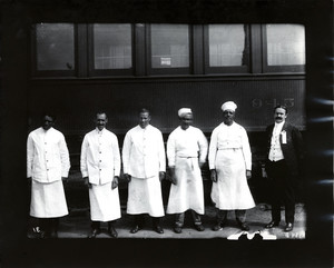Food service workers standing in front of a car of the Boston and Albany Railroad, Milford, Mass., ca. 1910