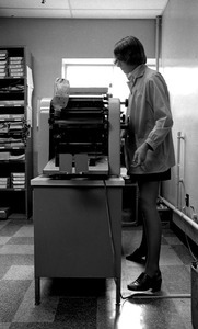 Secretary and mimeograph machine