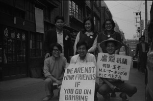Youthful antiwar demonstrators with signs