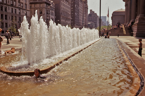 Boy swimming in fountain