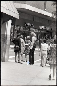 Free Spirit Press crew member handing out magazine on a street corner