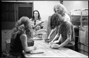 Julie Howard, Nick Carson, Gordon Adams, and Sammy Wolf (clockwise from left) working in commune bakery