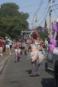 Parade marchers wielding hula hoops : Provincetown Carnival parade