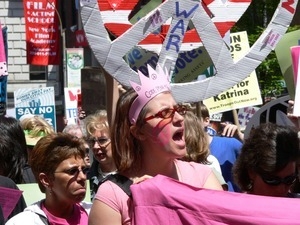 Code Pink antiwar marcher in the streets of New York, with pink crown, opposing the war in Iraq