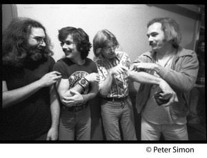 Grateful Dead backstage (left to right): Jerry Garcia, Mickey Hart, Phil Lesh, and Bill Kreutzman