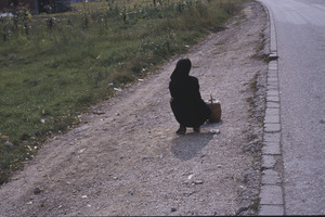 Waiting for the bus in mourning