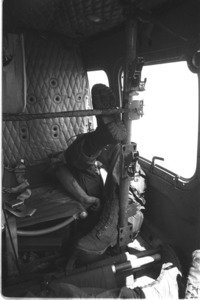 Body of a dead platoon sergeant in helicopter.