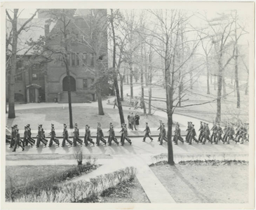 Army Air Corps trainees marching across campus (May 1943)