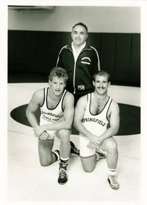 Doug Parker with two wrestlers