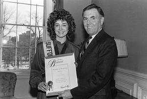 Mayor Raymond L. Flynn presenting certificate of recognition to unidentified woman