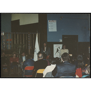 A woman speaking into a microphone as the audience looks on at the MADD 1991 Poster and Essay Contest