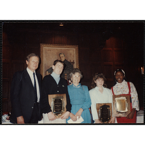 Three award recipients posing with a man and a woman at the "Recognition Dinner at Harvard Club"