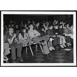 Boys' Club members and guests sitting in an auditorium and looking to the front during an event