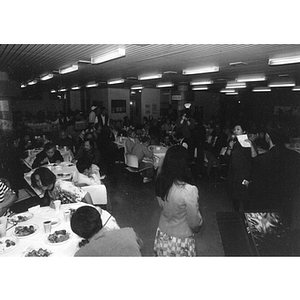 Guests eat dinner in the Josiah Quincy School cafeteria at a celebration marking Chinatown's victory to build a community center on Parcel C