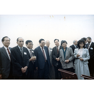 You King Yee and other members of the Chinese Progressive Association stand with the Vice Governor of Guangdong Province (in Boston for a visit) and others