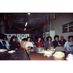 Audience and refreshments at a meeting between Mexican workers and the Chinese Progressive Association