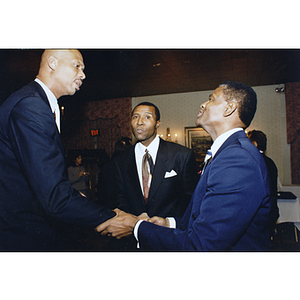 Kareem Abdul-Jabbar and two unidentified men at event