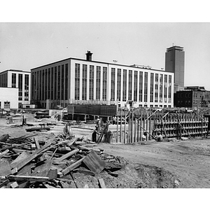 Early construction on addition to the Carl S. Ell Student Center looking at the Mugar building