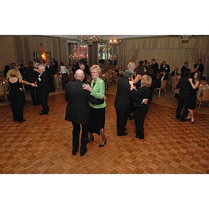 Couples dancing at a dinner honoring members of the Huntington Society