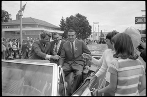 Robert F. Kennedy and Walter Mondale riding in a convertible down the streets of Worthington during the Turkey Day festivities