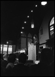 Stokely Carmichael speaking at the podium at the Youth, Non-Violence, and Social Change conference, Howard University