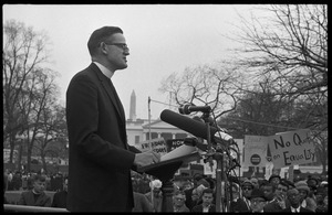 Priest addressing the crowd from the dais during a civil rights demonstration in front of the White House on Lafayette Square