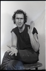 Studio portrait of Richard Safft, seated on a stool