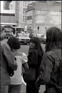 Young people on street in front of Steigers Department Store