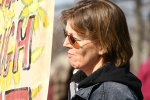 Protesters and sign: rally and march against the Iraq War