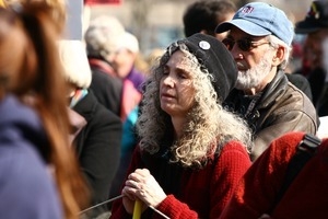 Woman protester in the crowd: rally and march against the Iraq War