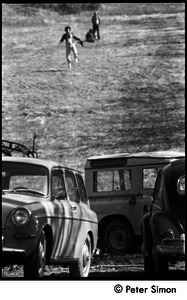 May Day at Packer Corners commune: cars parked at the base of a hill