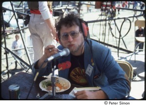 MUSE concert and rally: Danny Schechter (l) with two unidentified journalists