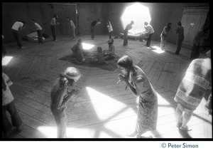 Sufi dancers bowing to one another inside the dome at the Lama Foundation