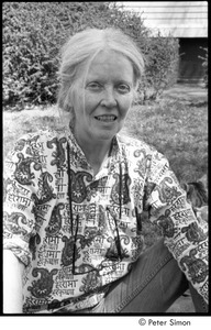 Ram Dass retreat at David McClelland's: portrait of Mary Sharpless McClelland sitting in the grass