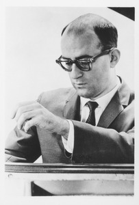 Howard M. Lebow sitting indoors