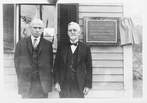 Jewell B. Knight (class of 1892) and Ephraim P. Felt (class of 1891) at the Insectary, with plaque reading 'This building erected 1889 was the original home of Economic Entomology at this college'