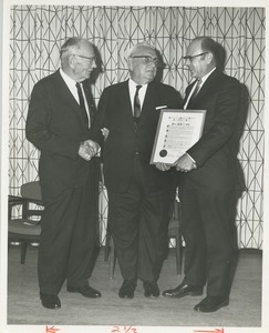 Dr. George G. Deaver and Dr. DiMichael presenting Dr. Frank Krusen with an award