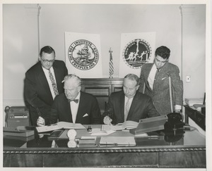 Presidents Bruce Barton of ICD and Carroll V. Newsom of NYU signing an affiliation agreement