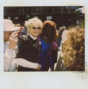 A Polaroid of Cocoa Rodriguez with Her Arm Around Another Person
