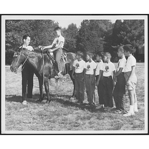 Boys participating in horseriding lesson at Camp Dorchester