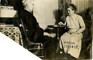 Maria and Harry Snyder playing checkers