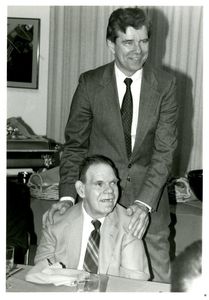 Athletics Director James E. Nelson and basketball team manager Charles Melanson (seated) at Suffolk University's athletics banquet, 1993