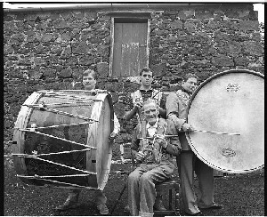 The Brownlees Family with Lambeg drum. Three generations from Ballymena, members of the Orange order, who play flutes and Lambeg drums, wearing Orange sashes