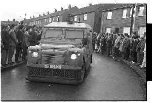 Funeral of John McMichael former leader of the UDA, killed in PIRA car bomb at his home. Shots of funeral leaving his house in Lisburn