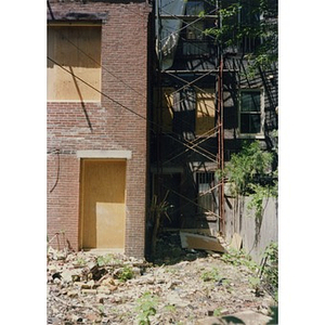 The rubble-strewn backyard of 326 Shawmut Avenue while the building was undergoing renovation.