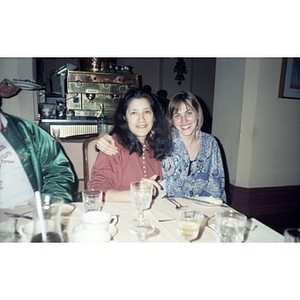 Clara Garcia and Inquilinos Boricuas en Acción staff member at a restaurant during a conference.