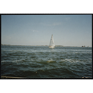 A boat sails in Boston Harbor