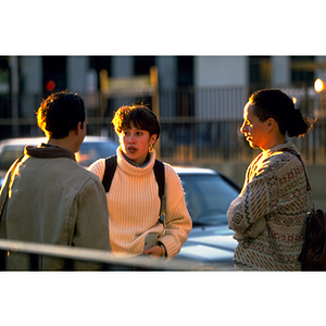 Three students speaking on Huntington Avenue