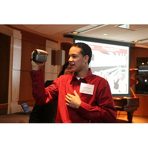 Odalis David Polanco uses a video camera at a Torch Scholars event