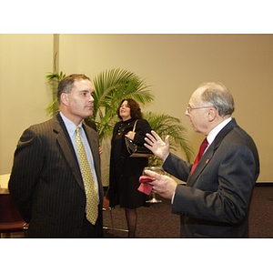 Joseph Malarny (CBA '82), left, conversing with a guest before the College Business Administration's Distinguished Service Awards ceremony
